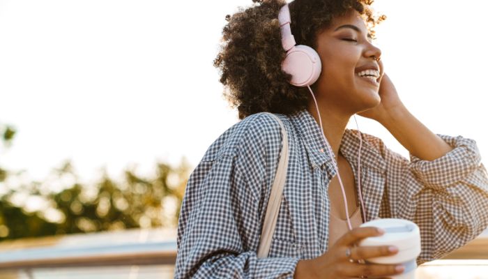 Women happily listening to music